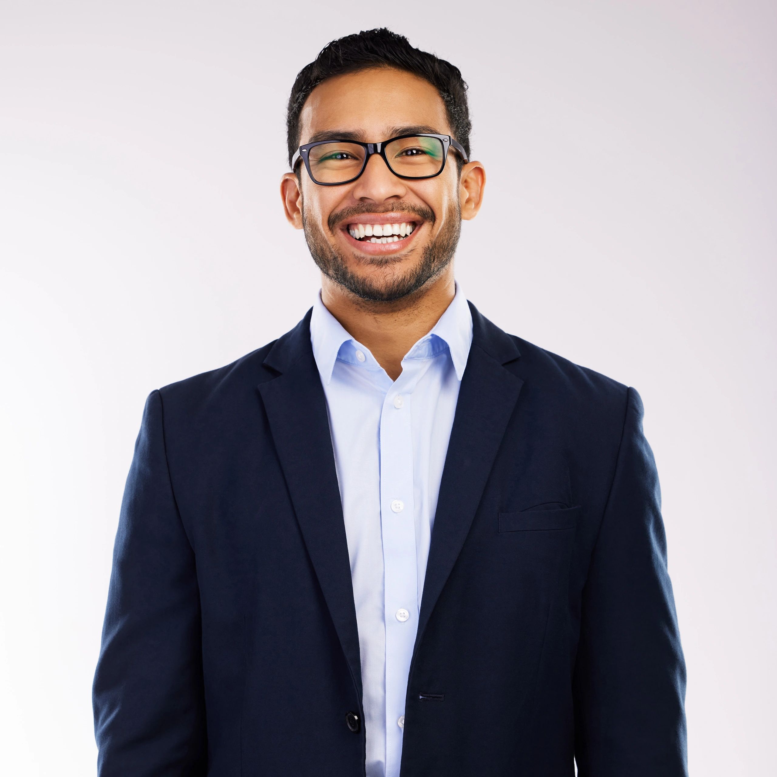 Professional headshot of a smiling man