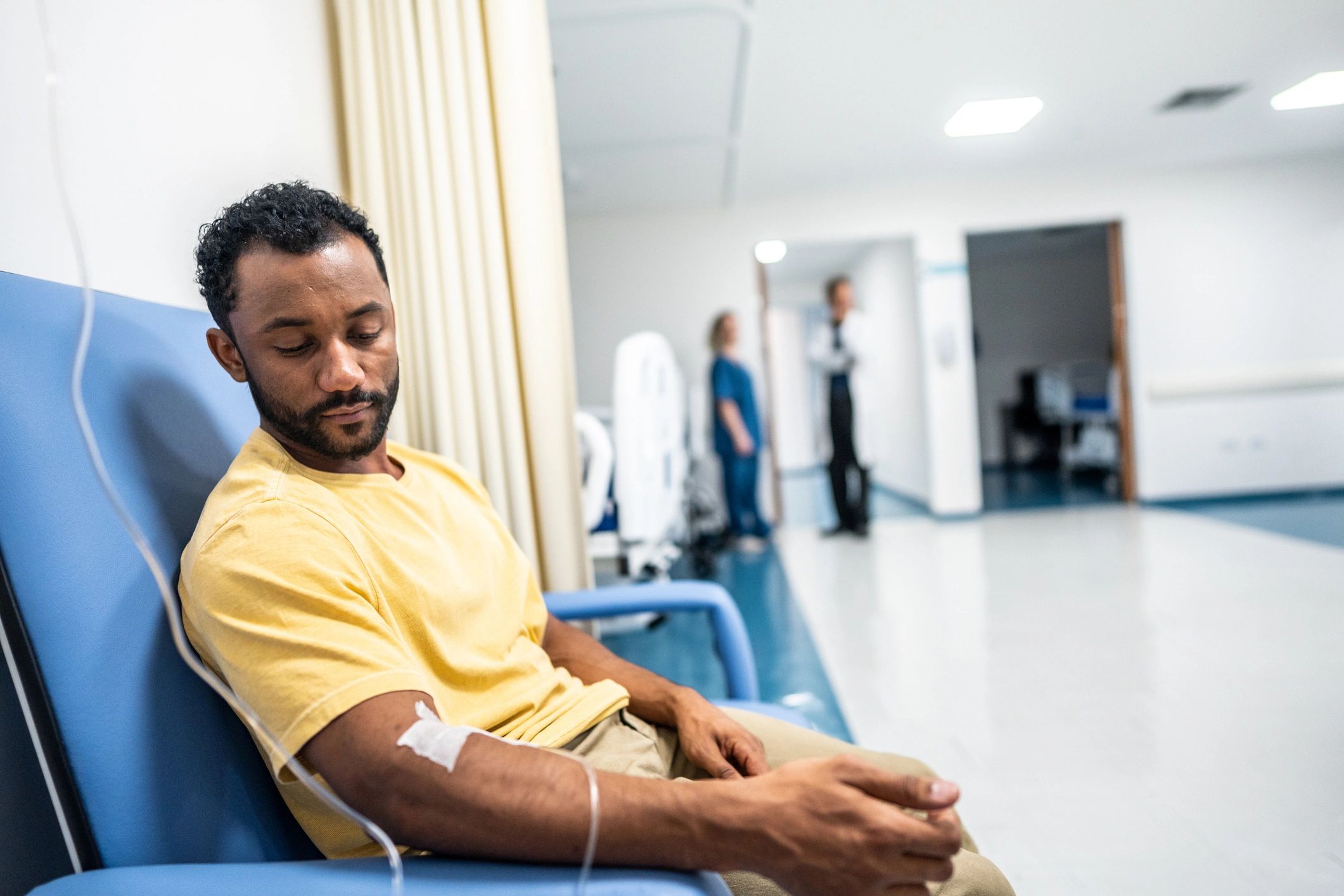 Patient receiving IV hydration therapy in a clinical setting